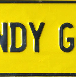 BUNDY GIRL Black on Yellow Novelty Number Plate